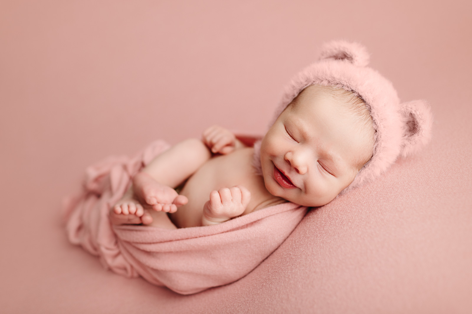 Smiling Newborn Baby Girl